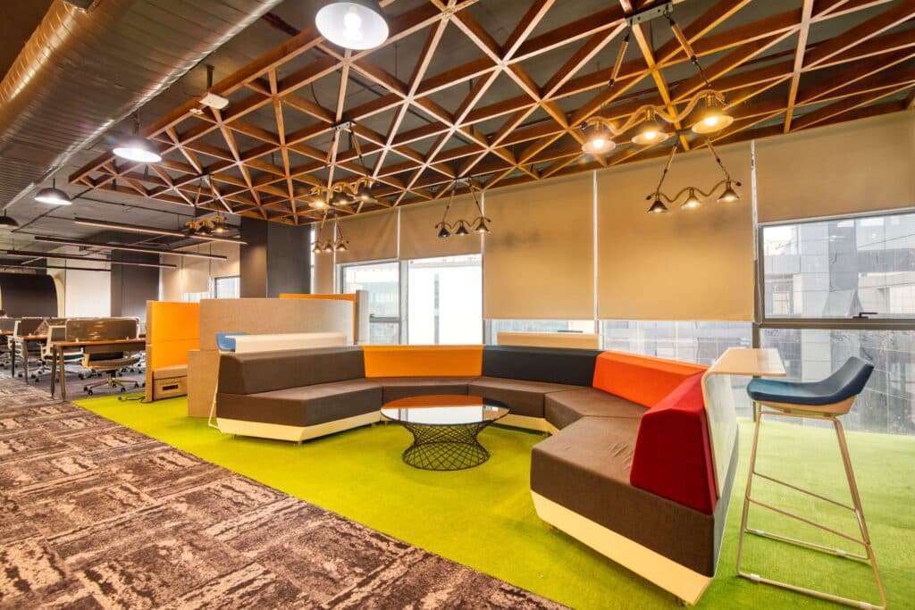bright office space with modular couches and workstations