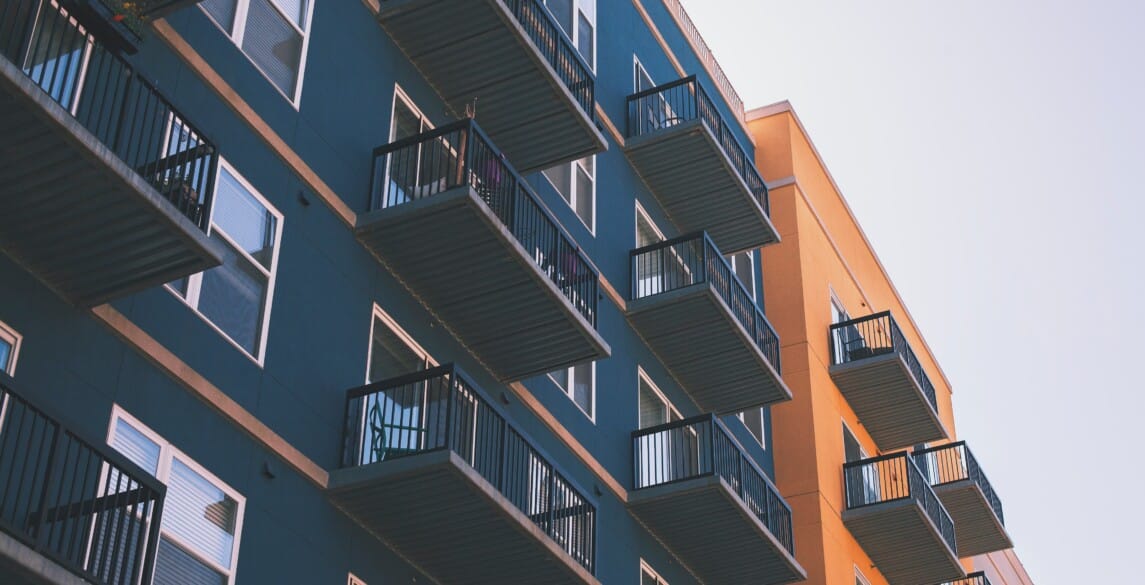 Exterior picture of a modern apartment building.