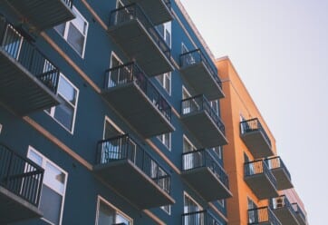 Exterior picture of a modern apartment building.