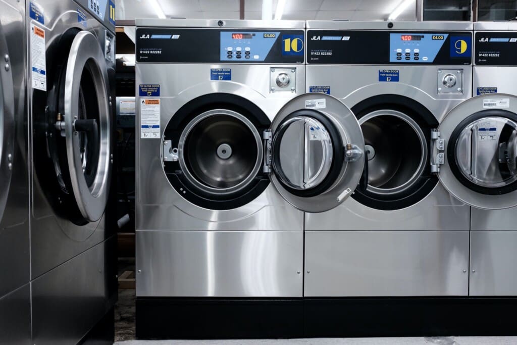 Washing machines on display in a store.