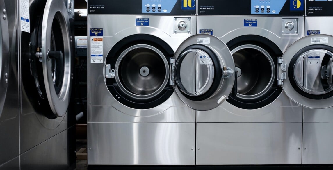 Washing machines on display in a store.