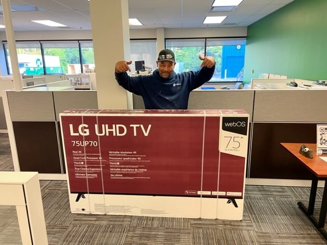 Eric Hill with his winning TV 