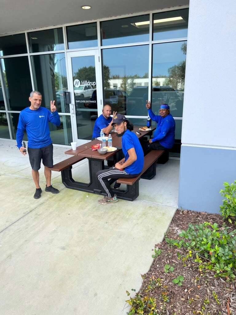 Warehouse teams enjoying lunch outside 