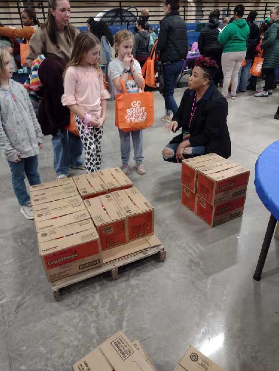 Ashley Gatewood speaking with Girl Scouts 