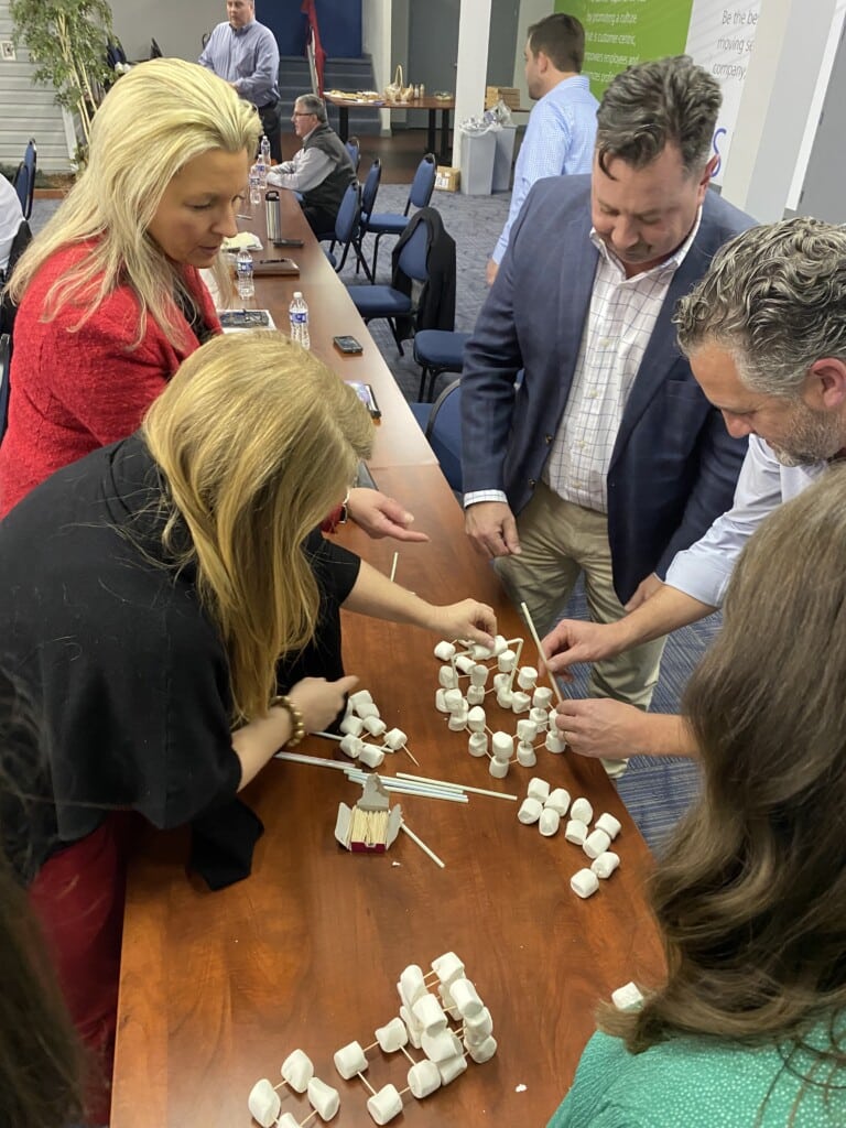 Team building activity with marshmallows during 2023 Sales Meeting 