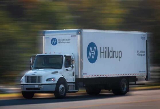 Hilldrup truck driving on road.