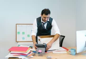Man packing up office supplies