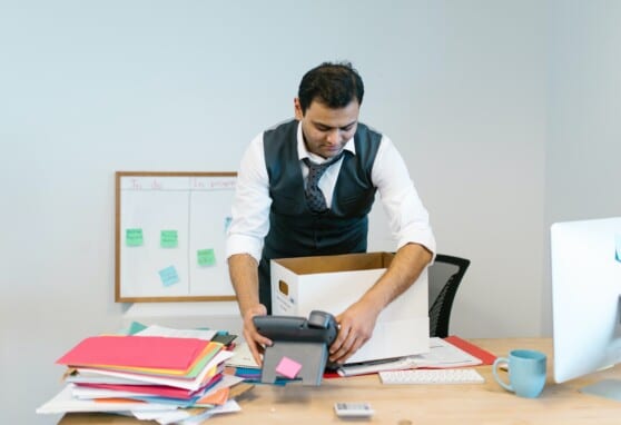 Man packing up office supplies