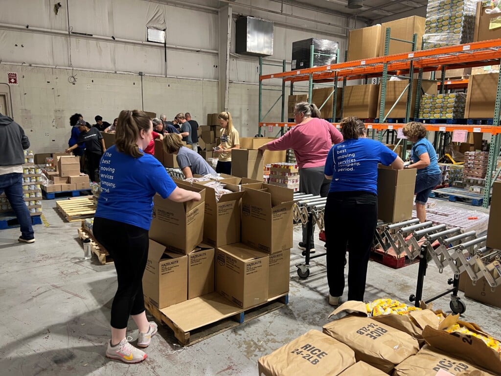 Volunteers at The Fredericksburg Food Bank loading boxes. 