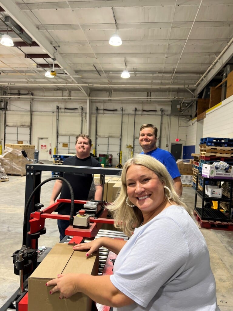 Hunter Watson, Bucky Burden and Onie Girton at the Fredericksburg Food Bank. 