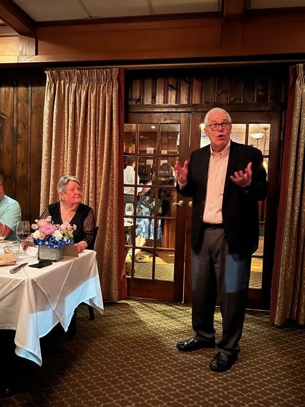 Harold Wood speaking during Brenda Harless' retirement dinner party. 