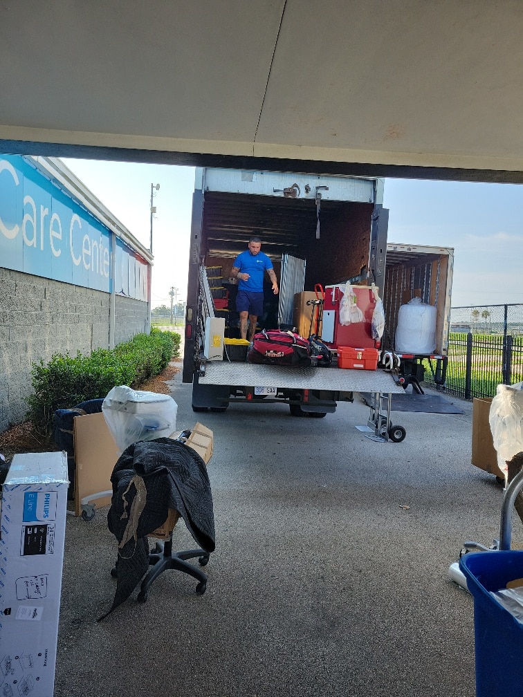 Hilldrup Orlando loads medical supplies into truck for AdventHealth 