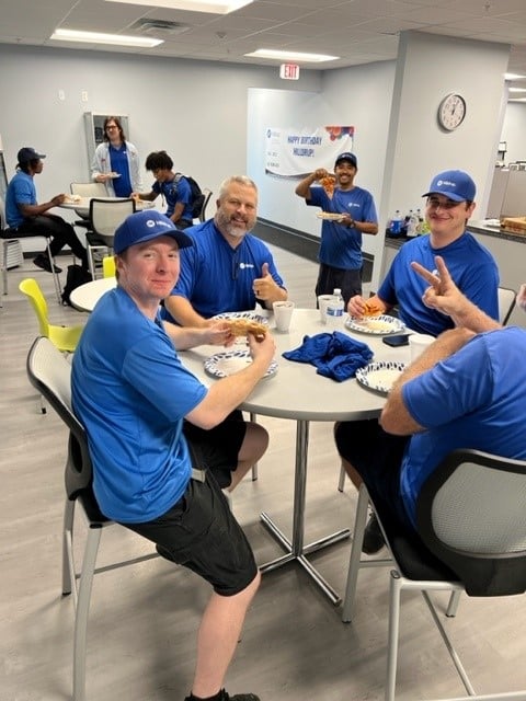 Orlando Van Operators enjoying pizza during Van Operator Appreciation Week 2023. 