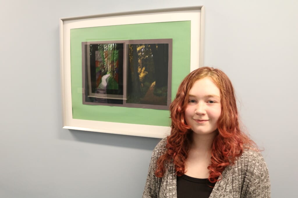 Stafford County art student with her artwork. 