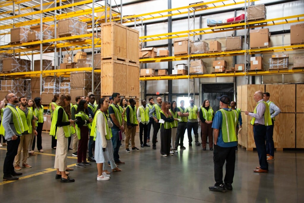 UVA students tour the inside of Hilldrup's International Warehouse. 