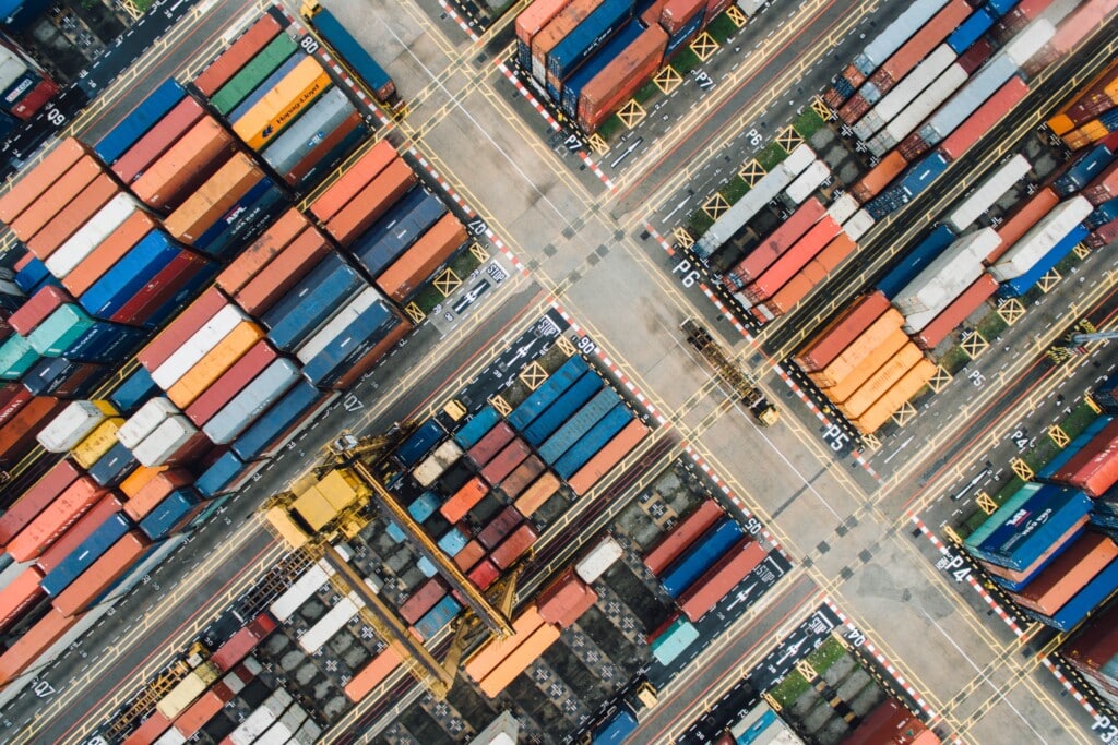 Aerial shot of shipping containers in a shipyard.