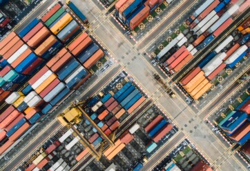 Aerial shot of shipping containers in a shipyard.