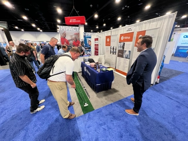 Attendees of the 2023 IFMA World Workplace event at Hilldrup's booth. 