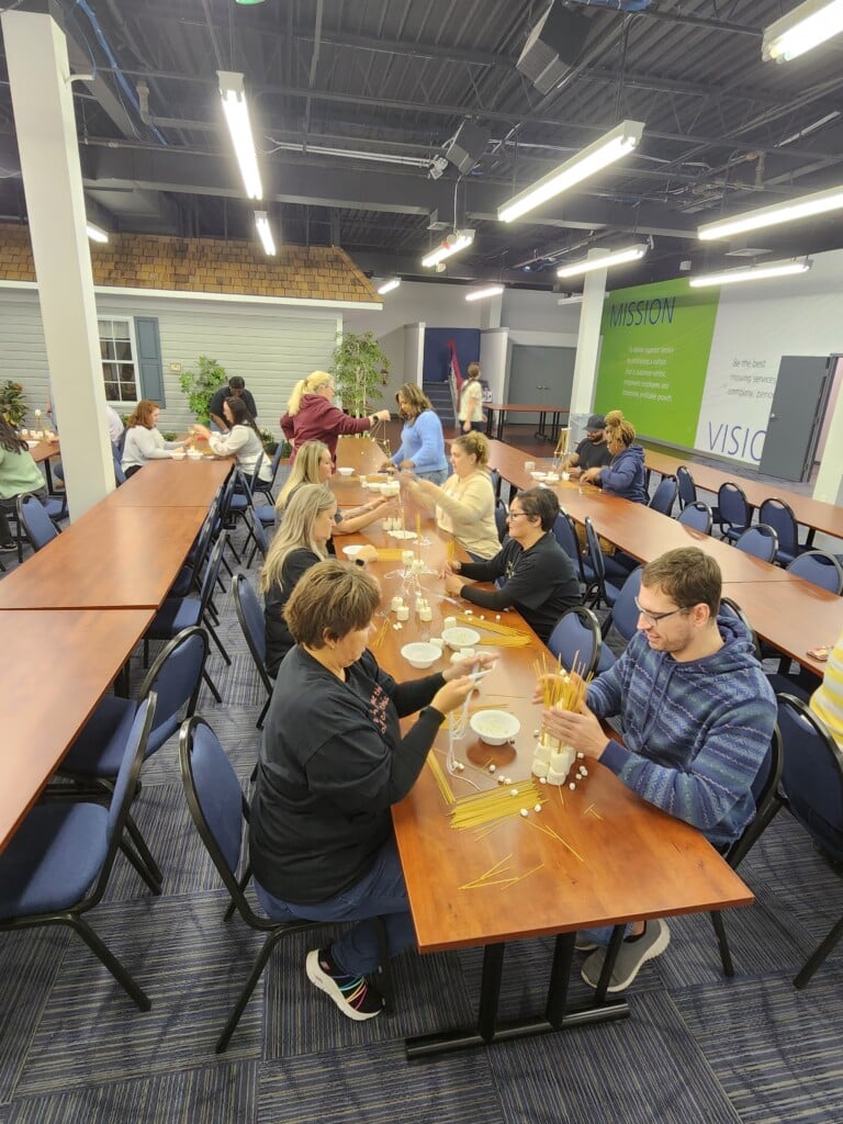 Employees working on building towers during RUW kickoff week. 