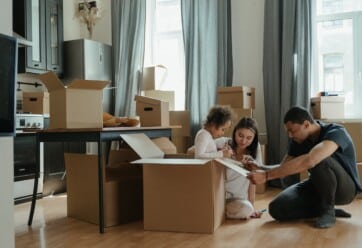 family packing up moving boxes