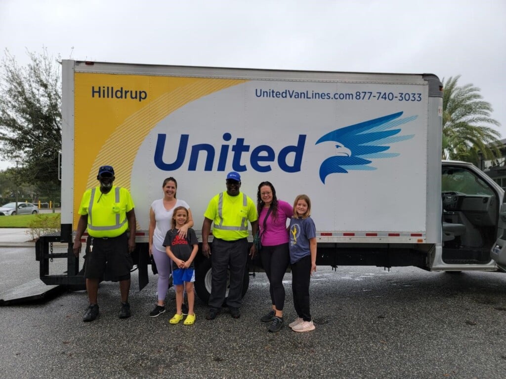 James Lewis and Al Fisher with volunteers by Hilldrup's truck. 