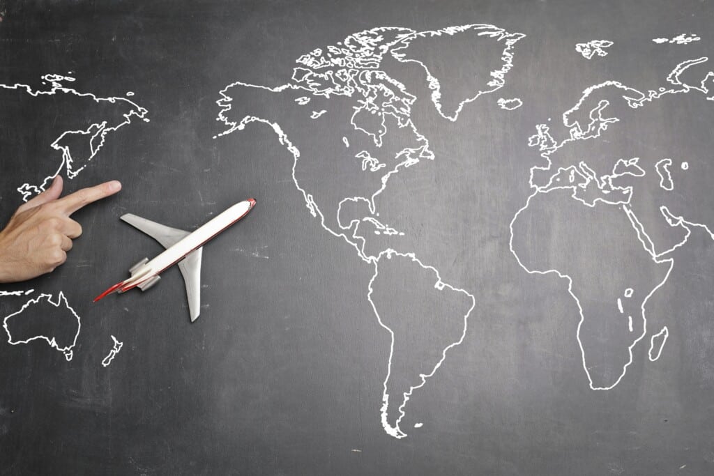 world map with plane heading to a new country