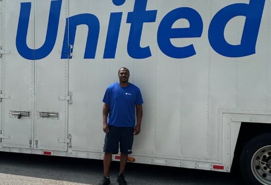 Wallace Wyatt in front of his truck