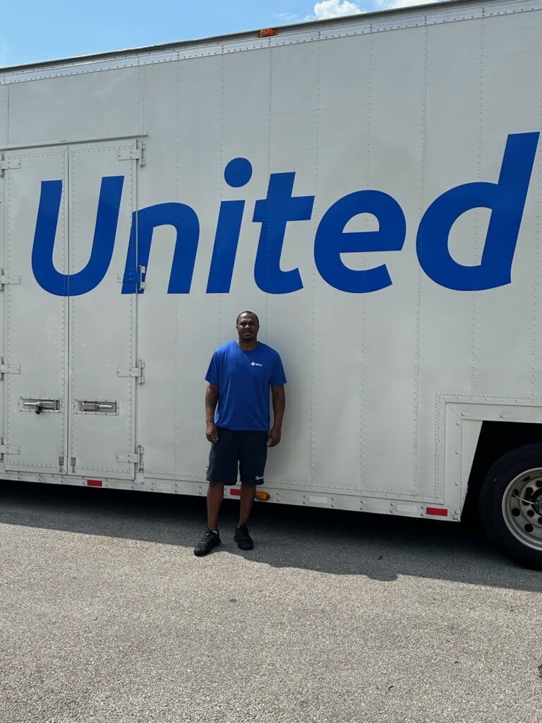 Wallace Wyatt in front of his truck