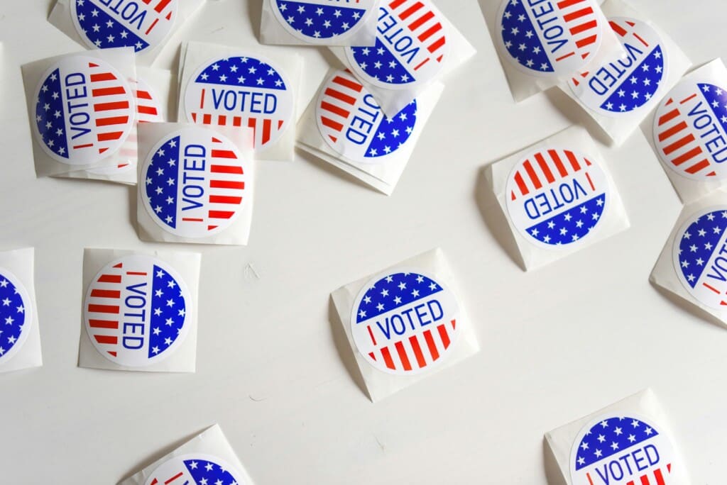 I Voted stickers on a white table