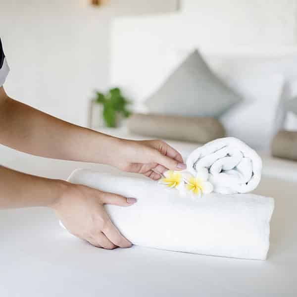 Housekeeper cleaning a hotel room