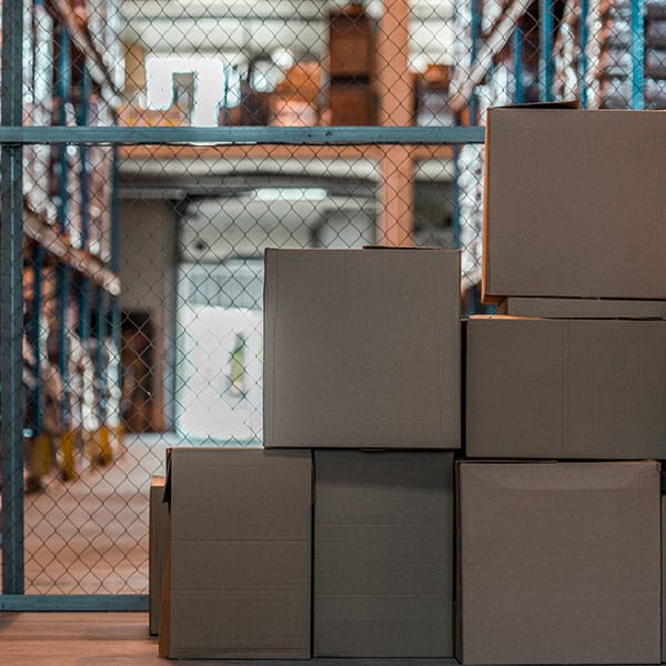 Cardboard boxes in modern storehouse interior.