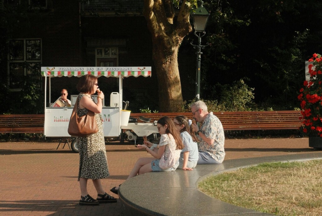 Family stopping to eat a treat outside