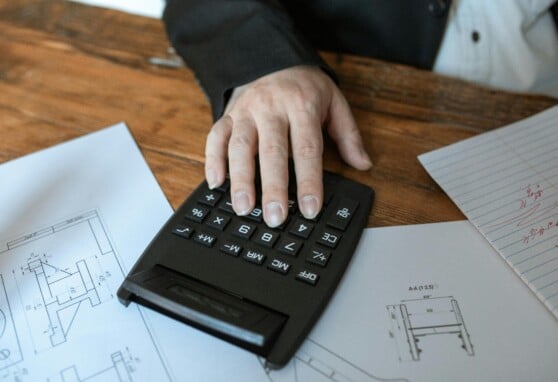 hand on a calculator