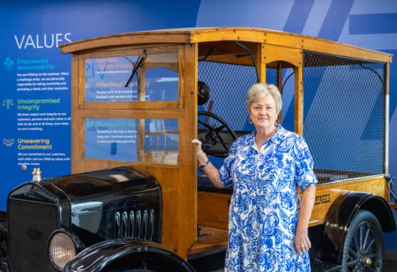 Linda Rivera in front of vintage Hilldrup truck