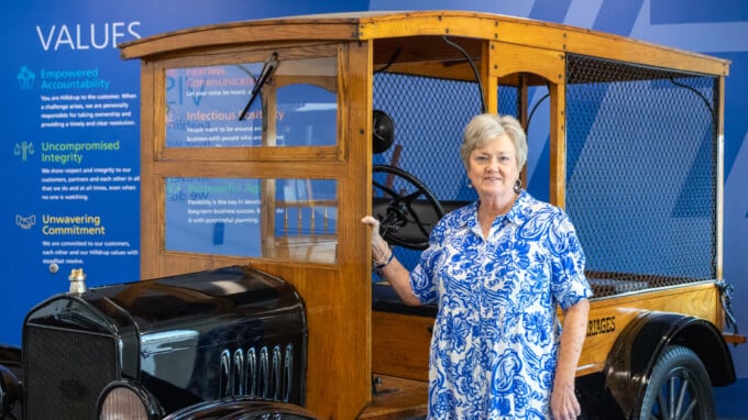 Linda Rivera in front of vintage Hilldrup truck