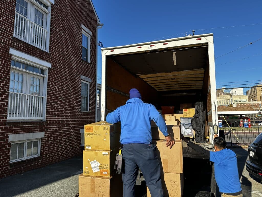 Hilldrup team unloading goods from a truck in downtown Richmond.